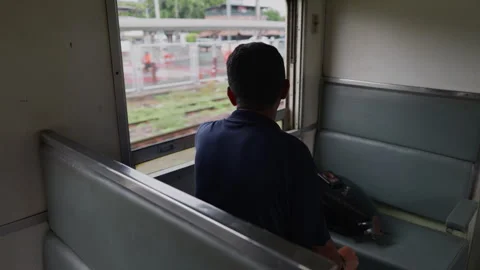 Local Passenger Back View on a Moving Train to Ayutthaya in Thailand Stock Footage 337532760
