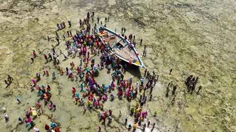 Local People Gathering Around a Stranded Fishing Boat at Low Tide, January 21, Video stock 336871645