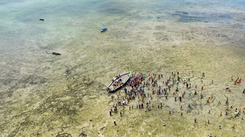 Local People Gathering Around a Stranded Fishing Boat at Low Tide, January 21, Video stock 336896088