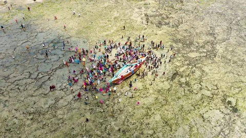 Local People Gathering Around a Stranded Fishing Boat at Low Tide, January 21, Video stock 336896121