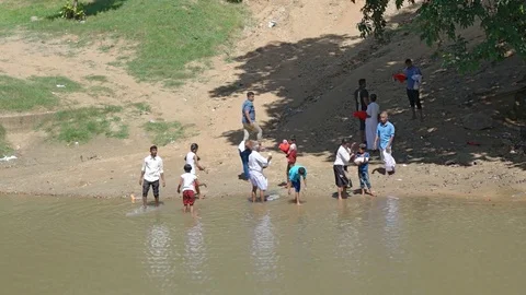 Local People Performing Ablutions in a River in Sri Lanka Stock Footage