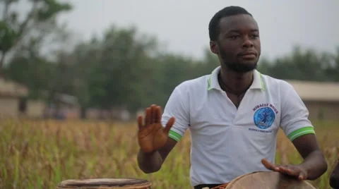 Local people playing drums in field, Ghana Stock Footage 62388408