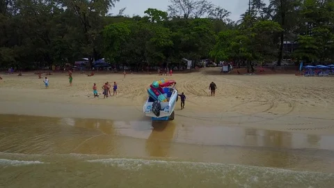 Local people prepare to launch motor boat to water from trailer, slowly pull Stock Footage 77916738