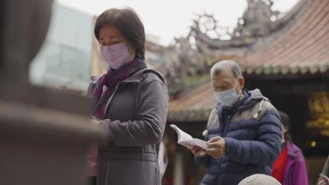 Local People Reading Buddhist Scriptures in the Courtyard of Lungshan Temple Stock Footage 293676982