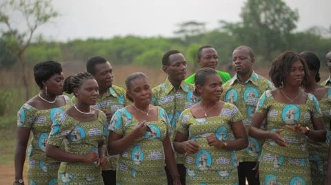 Local people singing and dancing in field, Ghana Stock Footage 62388426