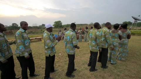 Local people singing and dancing in field, Ghana Stock Footage 62388433