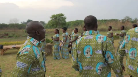 Local people singing and dancing in field, Ghana Stock Footage 62388436