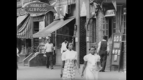 Local people walk besides Harlem sea Food - 1939 Stock Footage 89981972