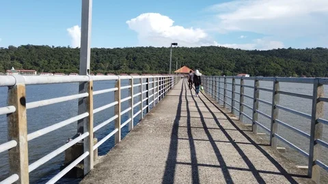 Local people walk on jetty Stock Footage 101085796