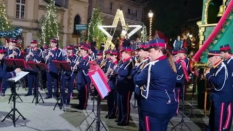 Local Philharmonic Orchestra Playing Instruments Outdoors Near Glowing Star in Stock Footage 332601201