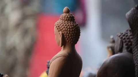 Local potters stacking hay on bisque fired pottery in home made kiln - Nepal Stock Footage 79838922