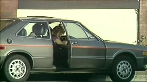 A LOCAL PROSTITUTE GETS IN A CAR BACK IN 1980S Stock Footage 243174166