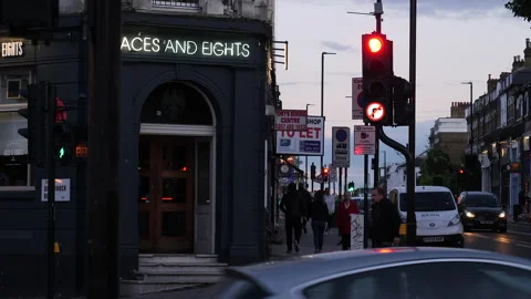 Local pub and side walk on street corner, early evening. London, United Kingdom. Stock Footage 218257436