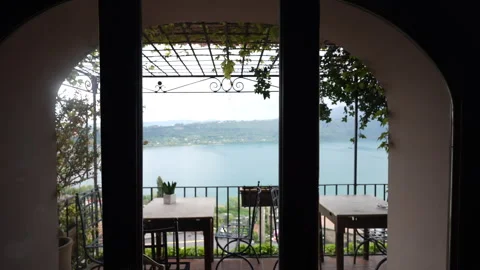 Local restaurant arched window leading to amazing terrace with magnificent Video stock 265439916