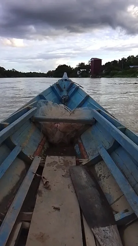 Local Sanaman Mantikei people using klotok boat to cross Samba River to farm Stock Footage 341906519