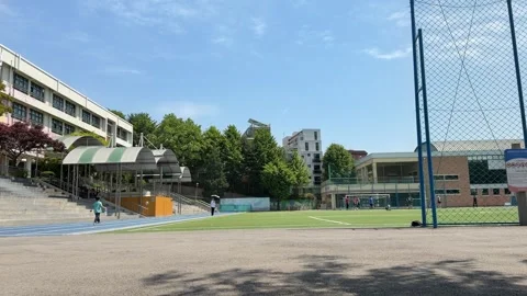 Local School Campus with Artificial Turf Sports Field in Seoul Stock Footage 338294694