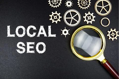 Local SEO text message with magnifying glass on black background Stock Photos