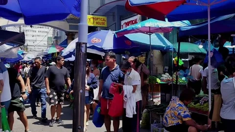 Local shoppers walking pass the bustling Quiapo Market Stock Footage 340123638