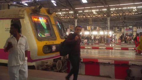 Local suburban train engine coach standing at CSMT railway station platform Stock Footage 309268296