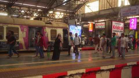Local suburban train standing on CSMT, Chhatrapati Shivaji Maharaj terminus Stock Footage 309078508