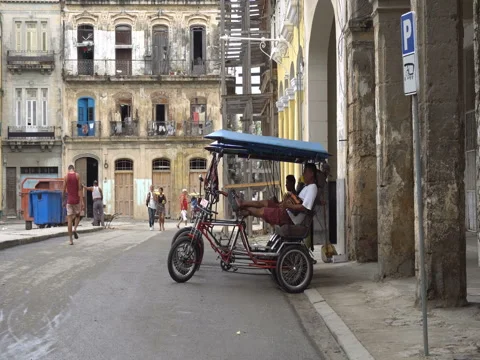 Local taxi rishaws without passengers are parked on central touristic street Stock Footage 70856804