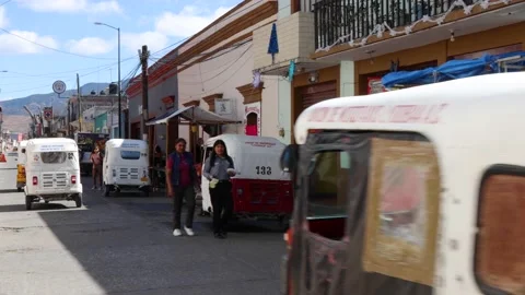 Local traffic driving through vibrant village Mitla in oaxaca mexico Stock Footage 228647959