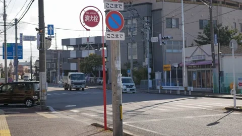 Local traffic at intersection street sidewalk in  fukuoka area with sunshine Stock Footage 230919743