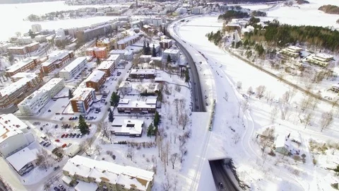 Local train arrives in small town with snowy surroundings. Stock Footage 88204437
