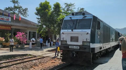 Local train arriving at Lang Co station Vietnam, Handheld 4k. Stock Footage 313486549