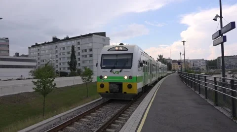 Local train departs from the station Stock Footage 65797407