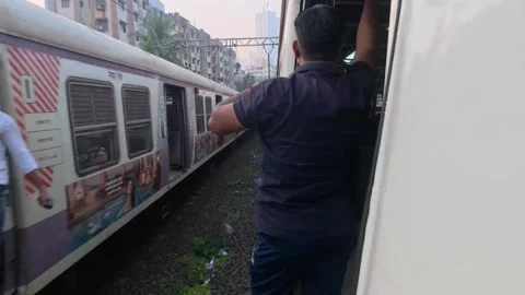 Local Train Door View Showing Railway Tracks and Passengers 4K Stock Footage 347519019