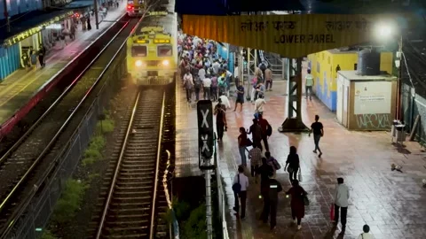 Local train passes at Lower Parel Station. 4K (Night View). Stock Footage 247891856