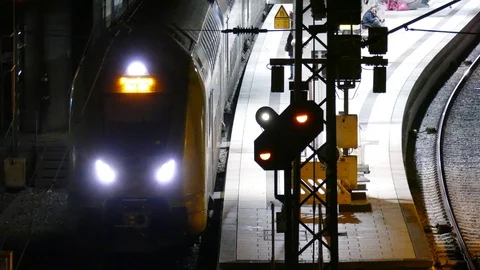 Local train with platform and train signal in Hamburg Central Station at nigh Stock Footage 121667167