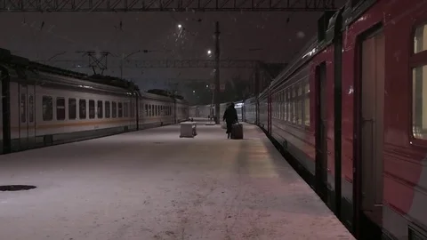 Local Train Station at Snowy Night. Lonely Human Figure Walking on Platform. 스톡 동영상 84852147