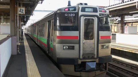 A local train stopped at the platform, Chitose Station, Japan, May 24, 2025. Stock Footage 335735955