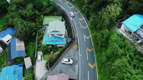 Local Train Tracks Through Mountain Countryside on Cloudy Day Stock Footage 290342578