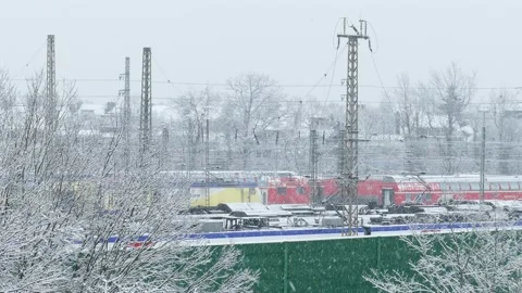 Local trains, railroad system, snowfall, green noise barrier , Bremen, German Stock Footage 235907257