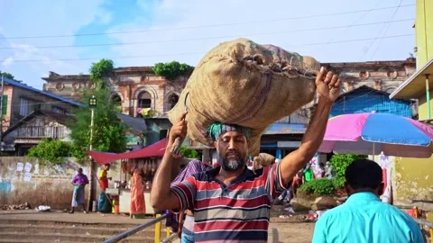 Local Transporting Goods on Head in Old Dhaka, Bangladesh - August 15, 2024 Stock Footage 311186833