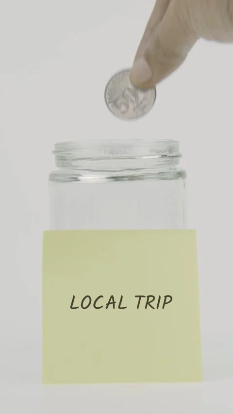 Local trip text or word on yellow sticky note attached to glass jar Stock Footage 311751032