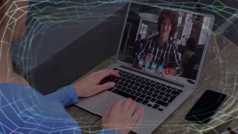 Local user shifting hands while laptop showing remote host nudging tiny eggs Stock Footage 331235942