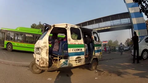Local van stop at sidewalk to pick up commuters, vehicle moving on road Stock Footage 197003931