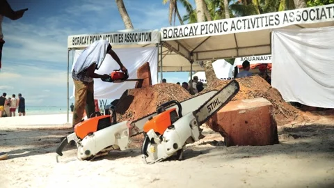 Local workers cutting palm tree with chainsaws Boracay Philippines 스톡 동영상 334089766