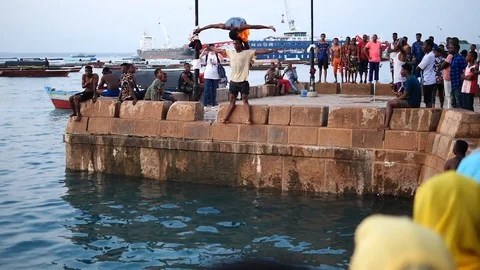 Locals doing acrobatic diving in Stone Town, Zanzibar. Stock Footage 114003590