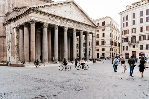 Locals enjoying an empty square in front of the Pantheon in Rome during the C Stock Photos