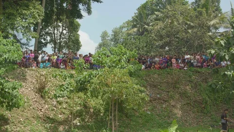 Locals gathered on a hill Stock Footage 87147076