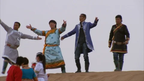 Locals having fun on sand dune in Gobi desert Stock Footage 88337092