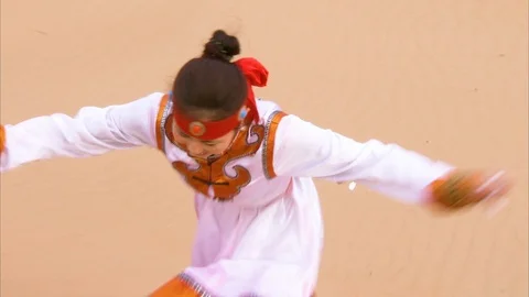 Locals having fun on sand dune in Gobi desert Stock Footage 88337639