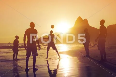 Locals Playing Ball at Sunset in Ipanema Beach, Rio de Janeiro, Brazil Stock Photos