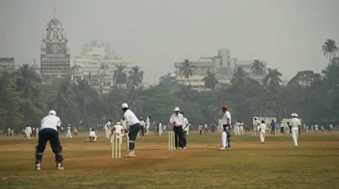 Locals playing cricket in the Oval Maidan, Mumbai, India Stock Footage