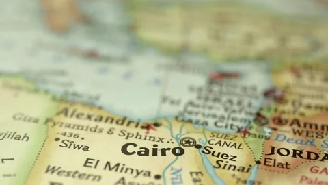 Location Cairo in Egypt on travel map, Africa, man hand push pin close-up Stock Footage 181605130